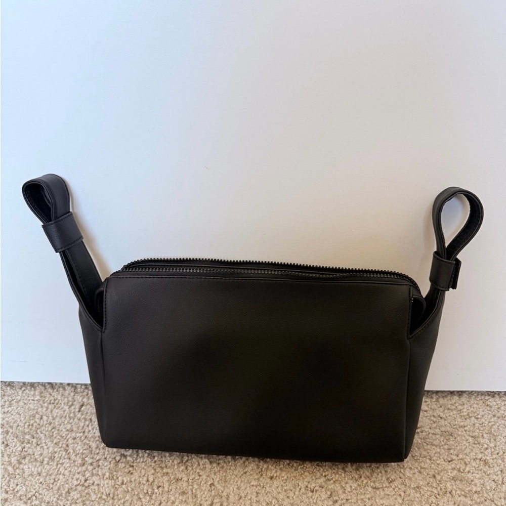 Elegant Black Leather Bag with Unique Handles